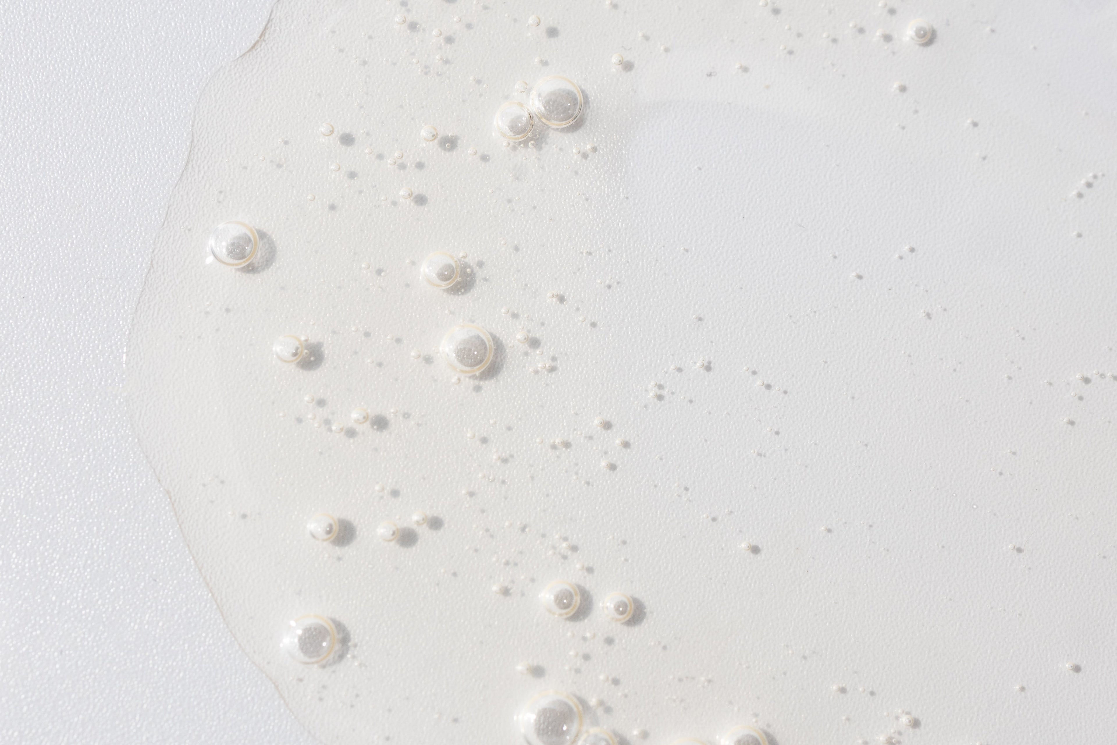 A close up of a bubbly serum swatch