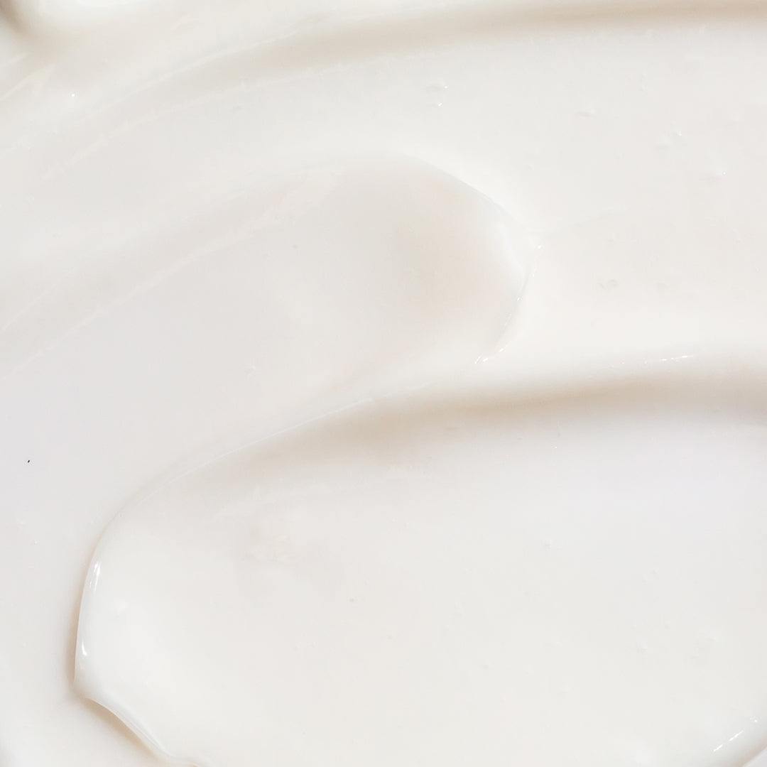 A close up swatch of a creamy moisturizer