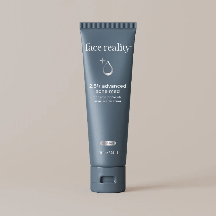 Face Reality's 2.5% advanced acne med in blue tube packaging with a beige backdrop