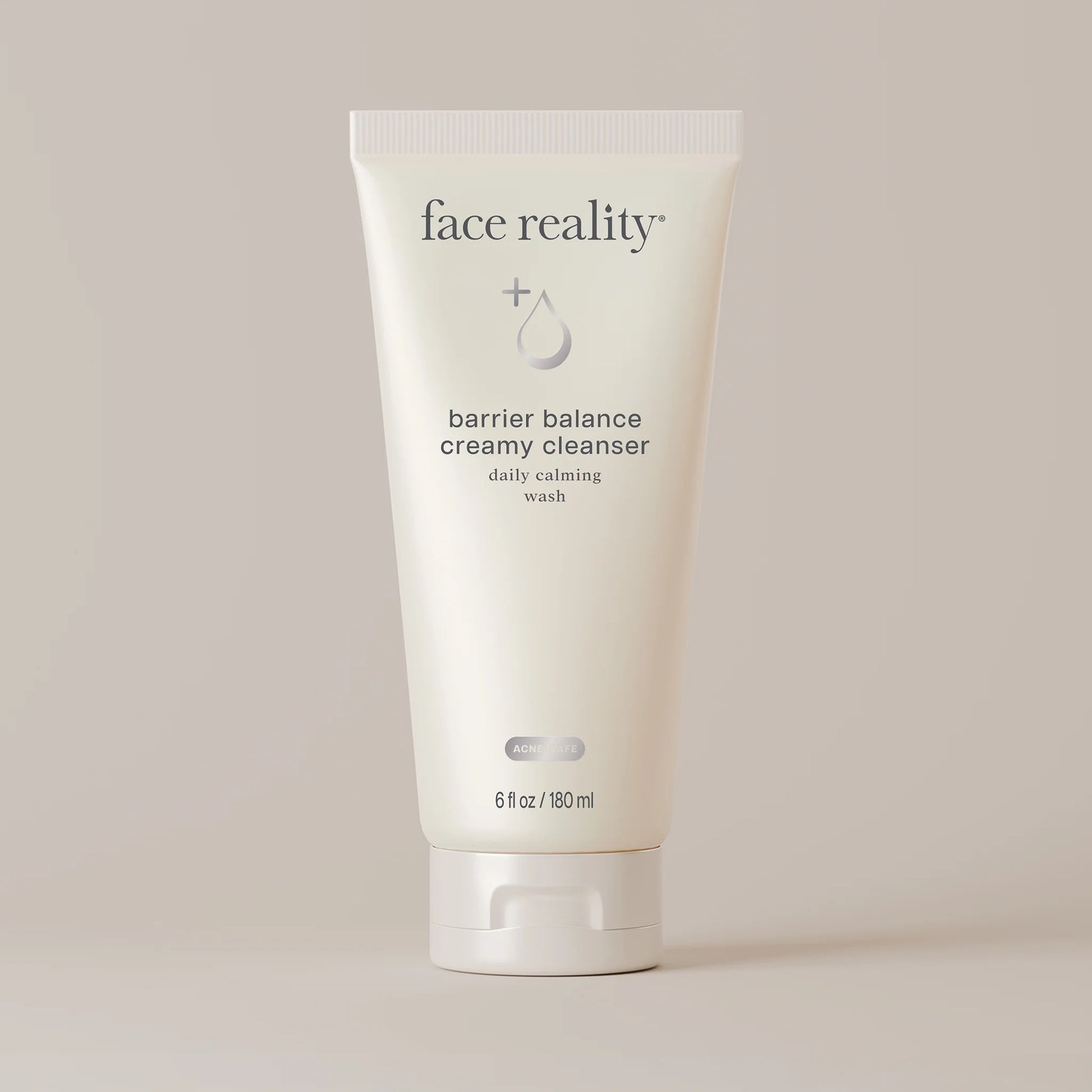 Face Reality's barrier balance creamy cleanser white product tube on beige backdrop