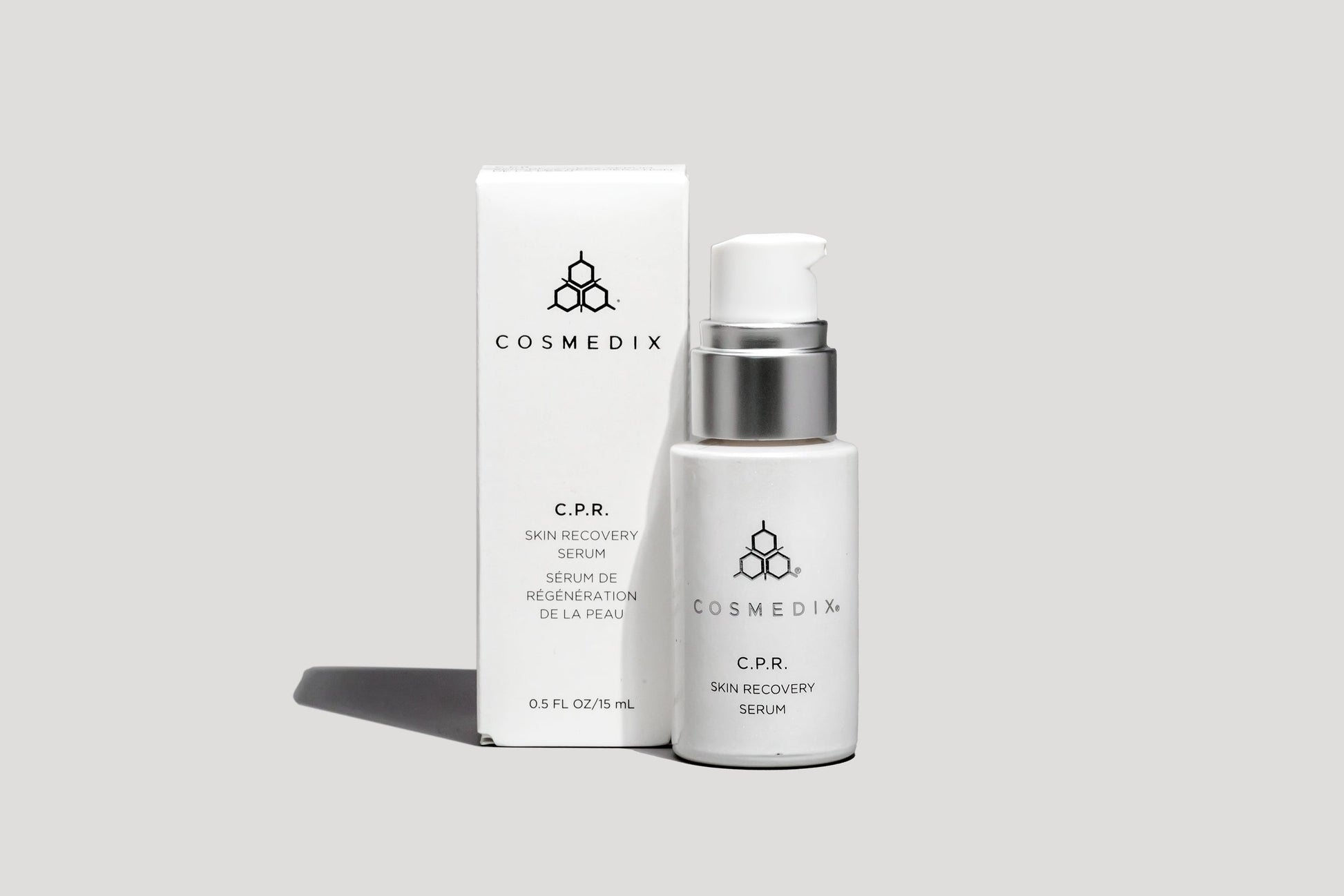 COSMEDIX's C.P.R Skin Recovery Serum in white-colored product bottle with pump dispenser, standing beside white product packaging box