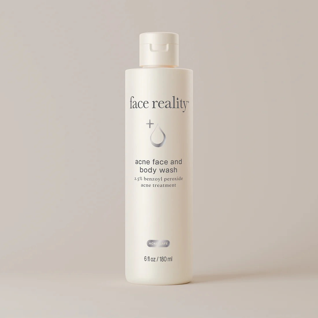 Face Reality's acne face and body wash in white product bottle with beige background