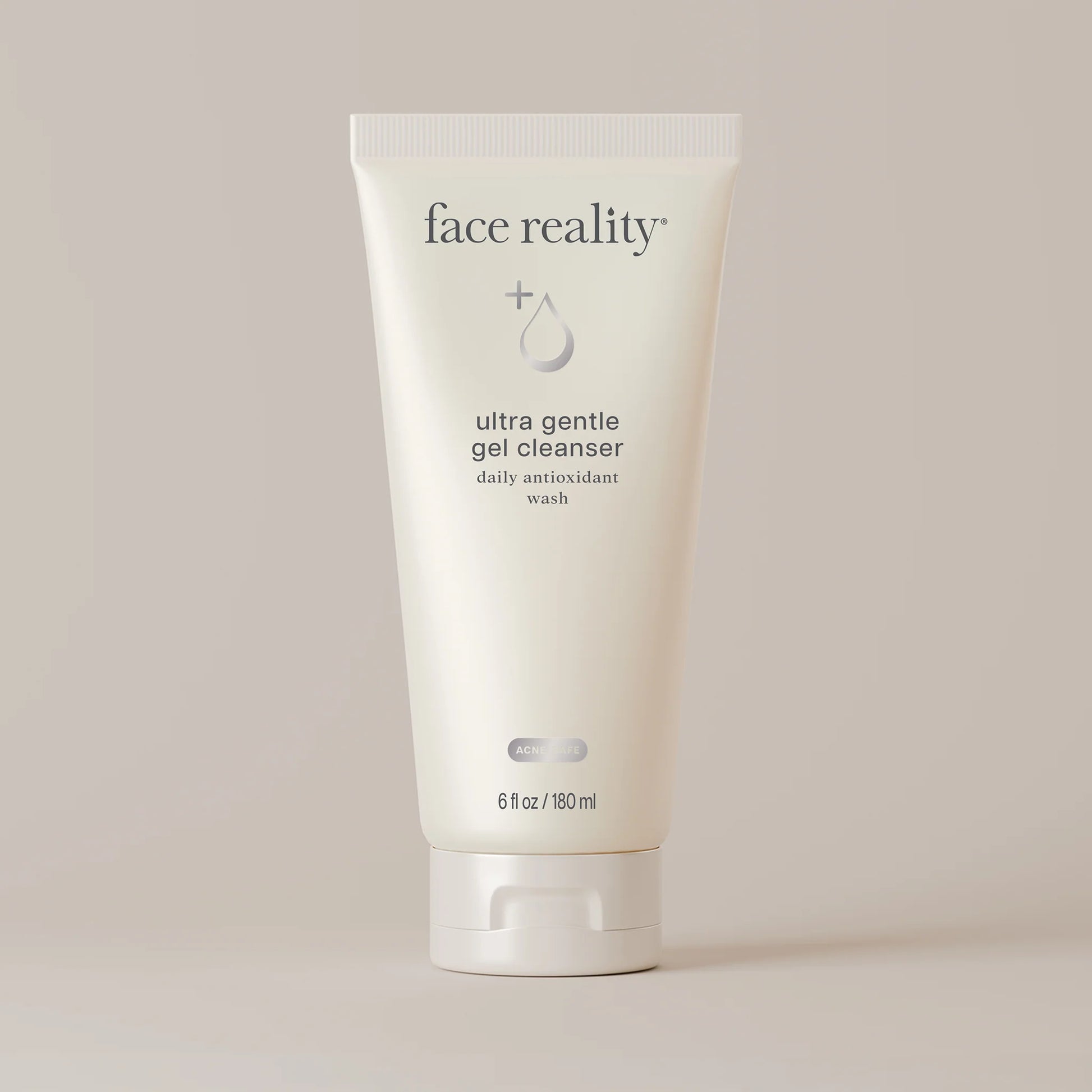 Face Reality's ultra gentle gel cleanser in cream-colored product tube against beige background