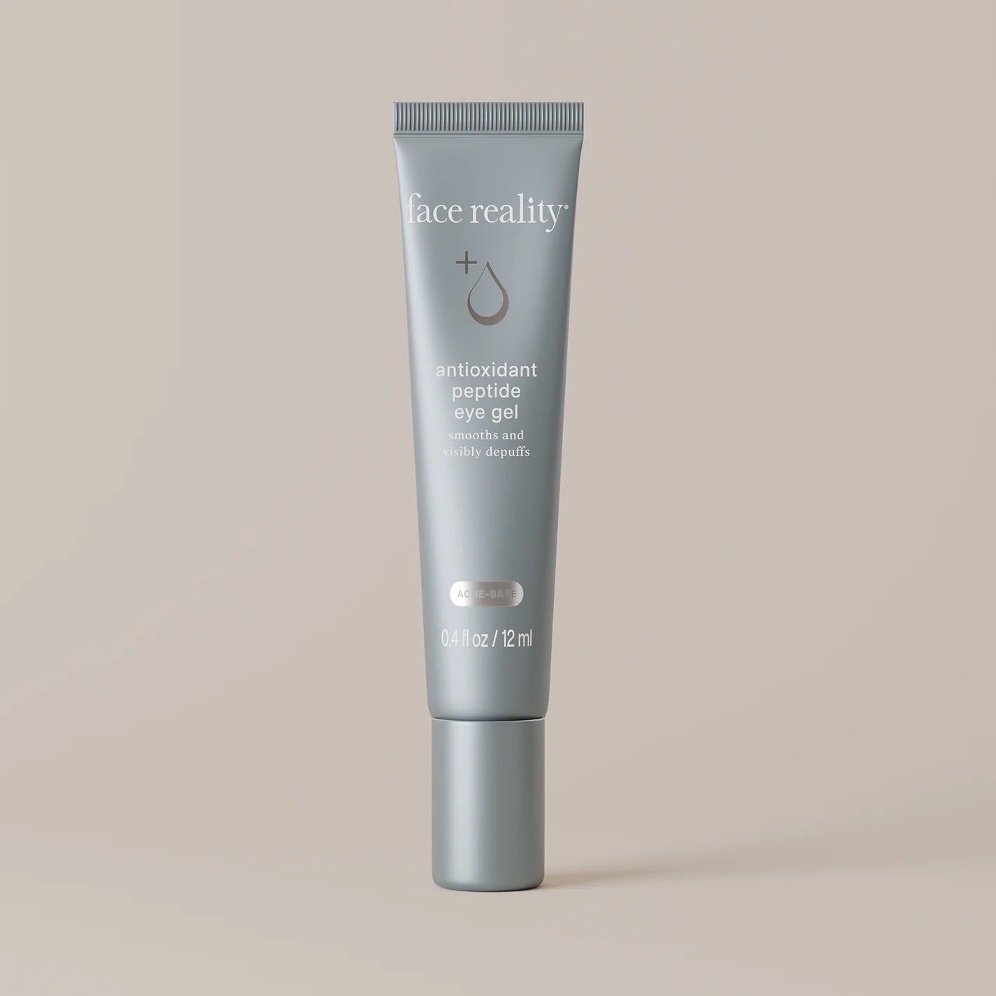 Face Reality's antioxidant peptide eye gel in blue tube packaging with beige backdrop