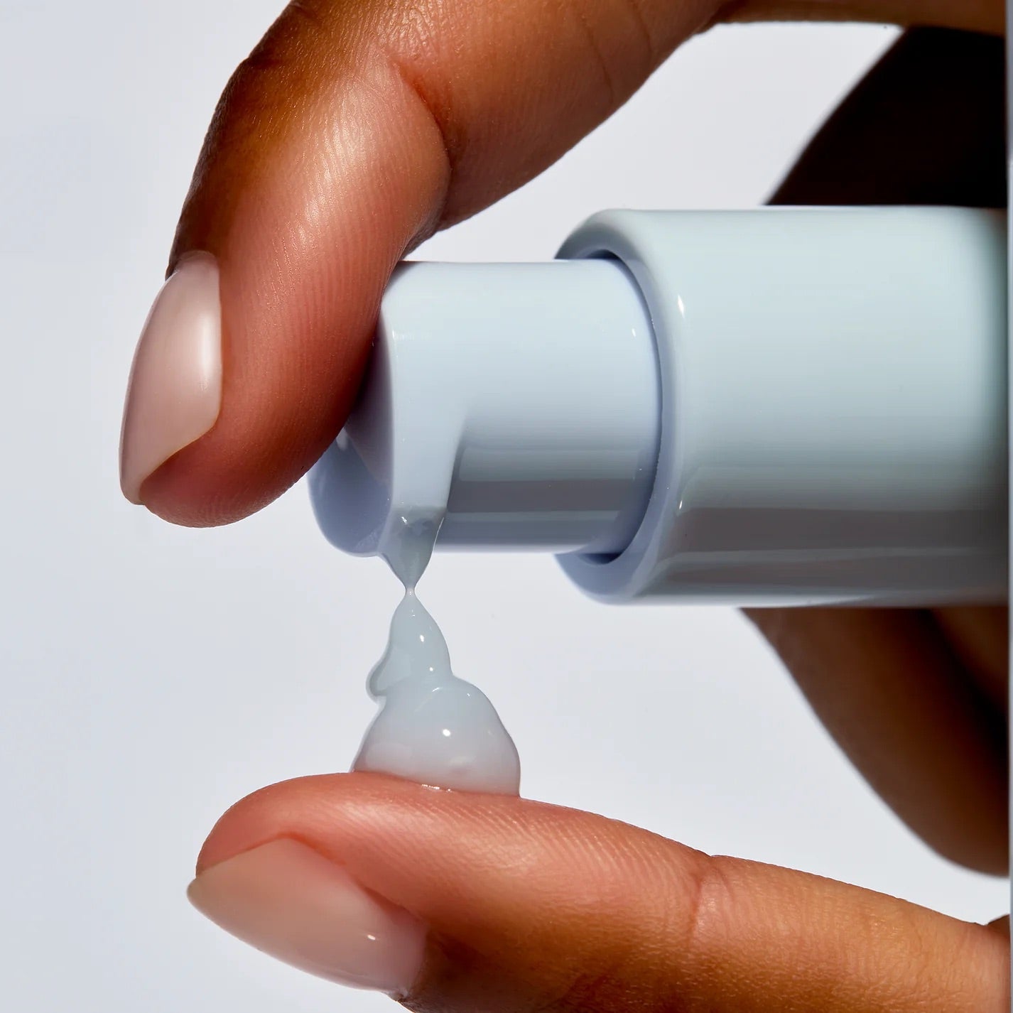 Face Reality's HydraRemedy gel serum being dispensed onto fingertips