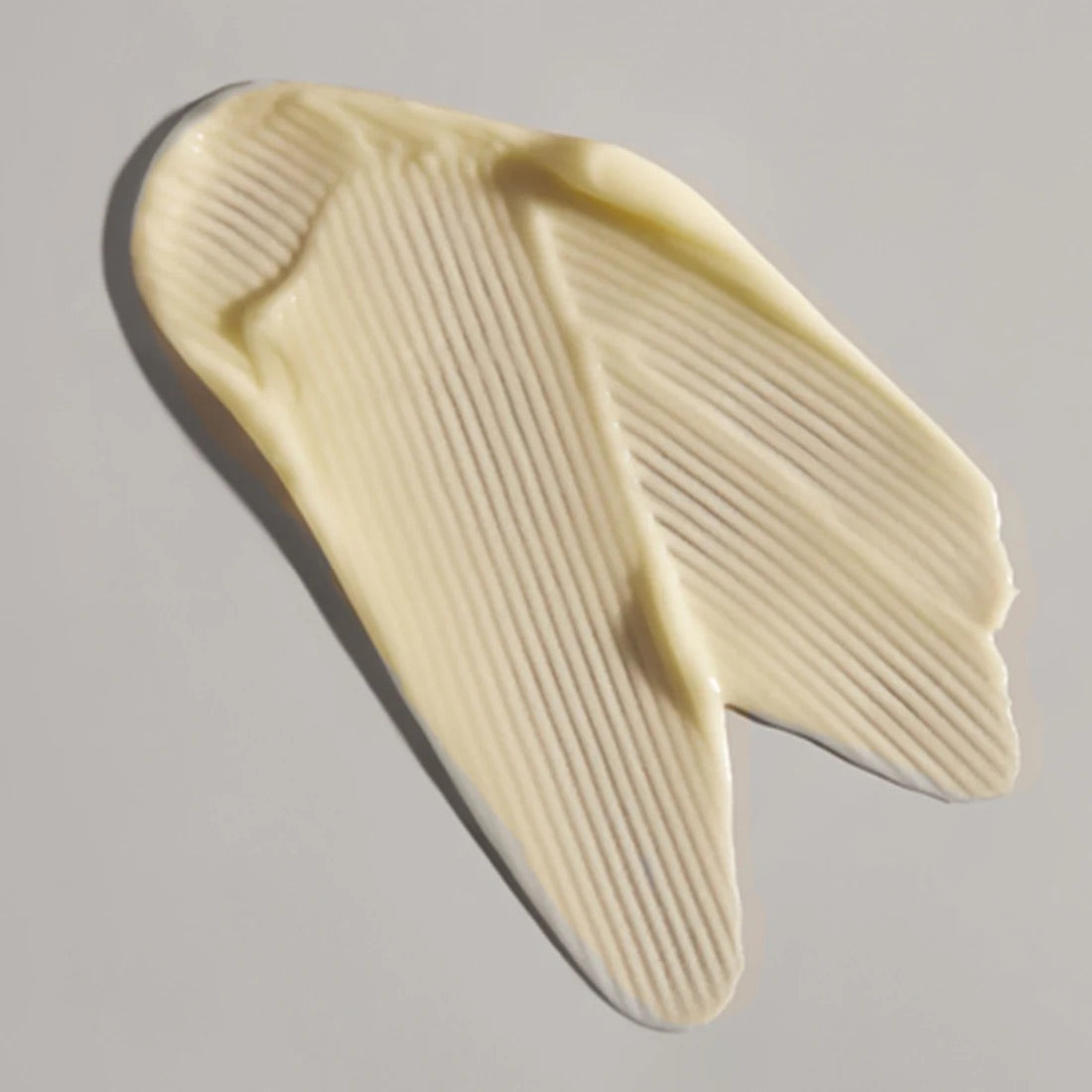 Face Reality's sulfur spot treatment cream-colored product swatch against grey background