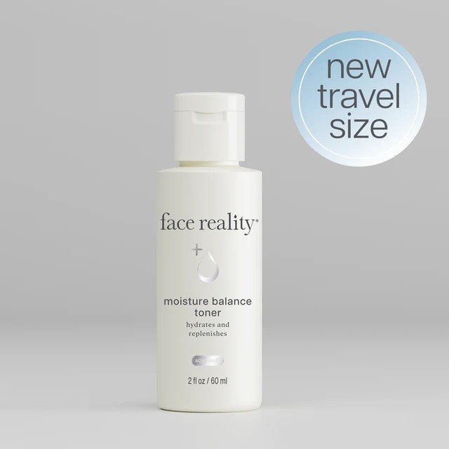 Face Reality's moisture balance toner in travel-size cream-colored bottle against grey background