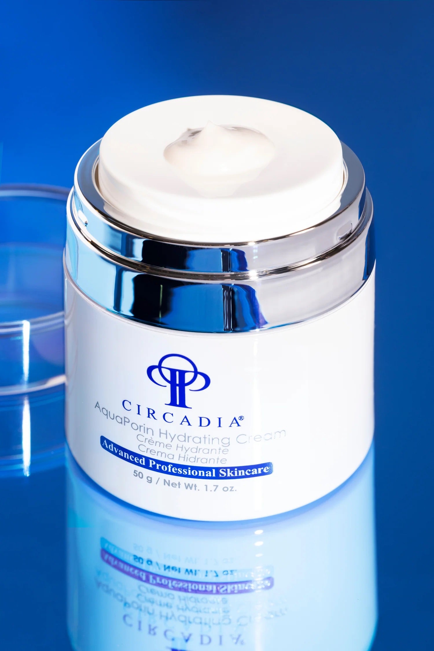 Circadia's AquaPorin Hydrating Cream, product bottle with push button dispenser lid, against blue background