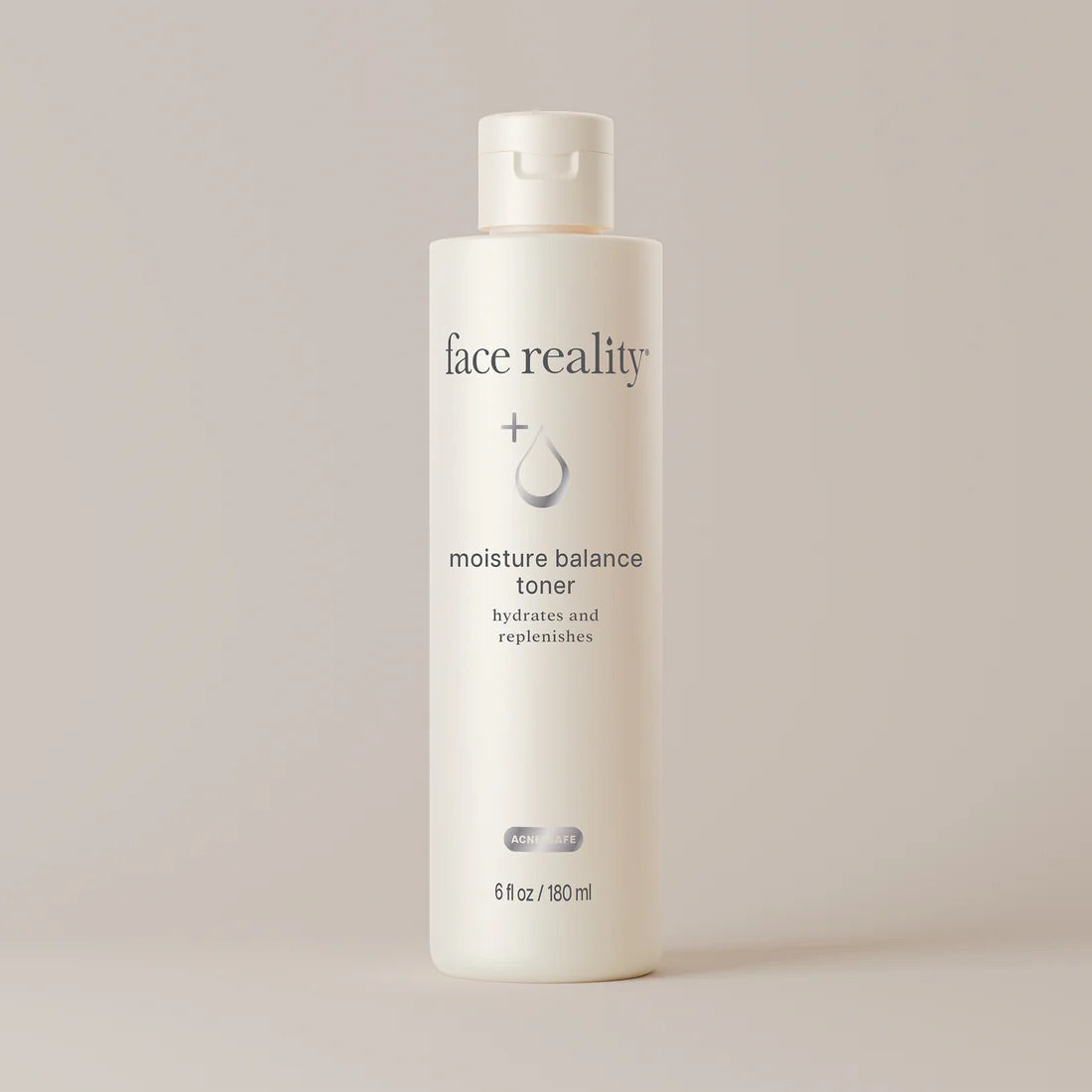 Face Reality's moisture balance toner in cream colored bottle against beige background