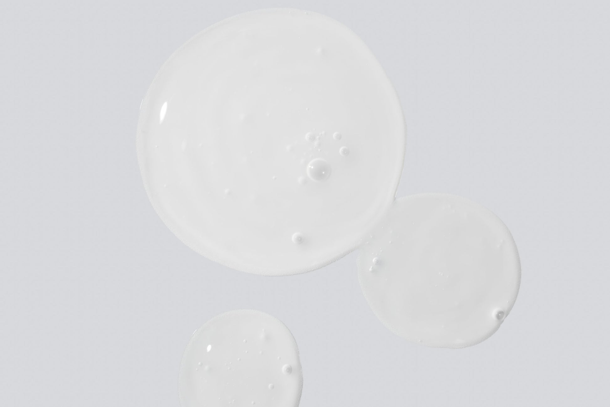 COSMEDIX's Reboot Overnight Hydration Complex clear colored product droplets against light grey background
