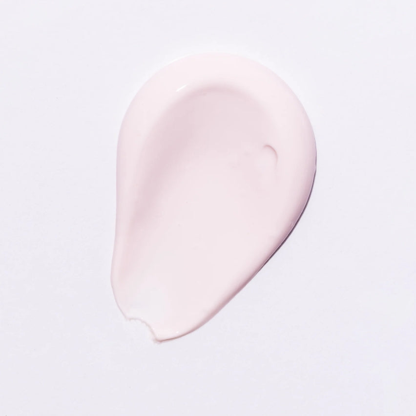 Face Reality's Brilliant Defense SPF 50 light pink colored product swatch against white background