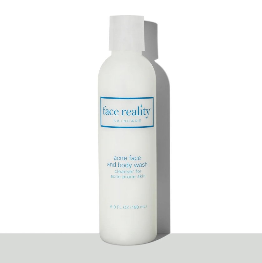 Face Reality's acne face and body wash in old packaging, a white bottle against a white backgroun