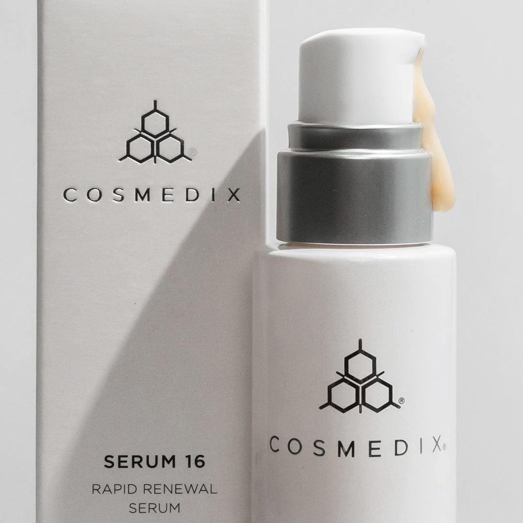  Zoomed in view of COSMEDIX's Serum 16 Rapid Renewal Serum product bottle with cream colored product oozing from dispenser, standing beside product box