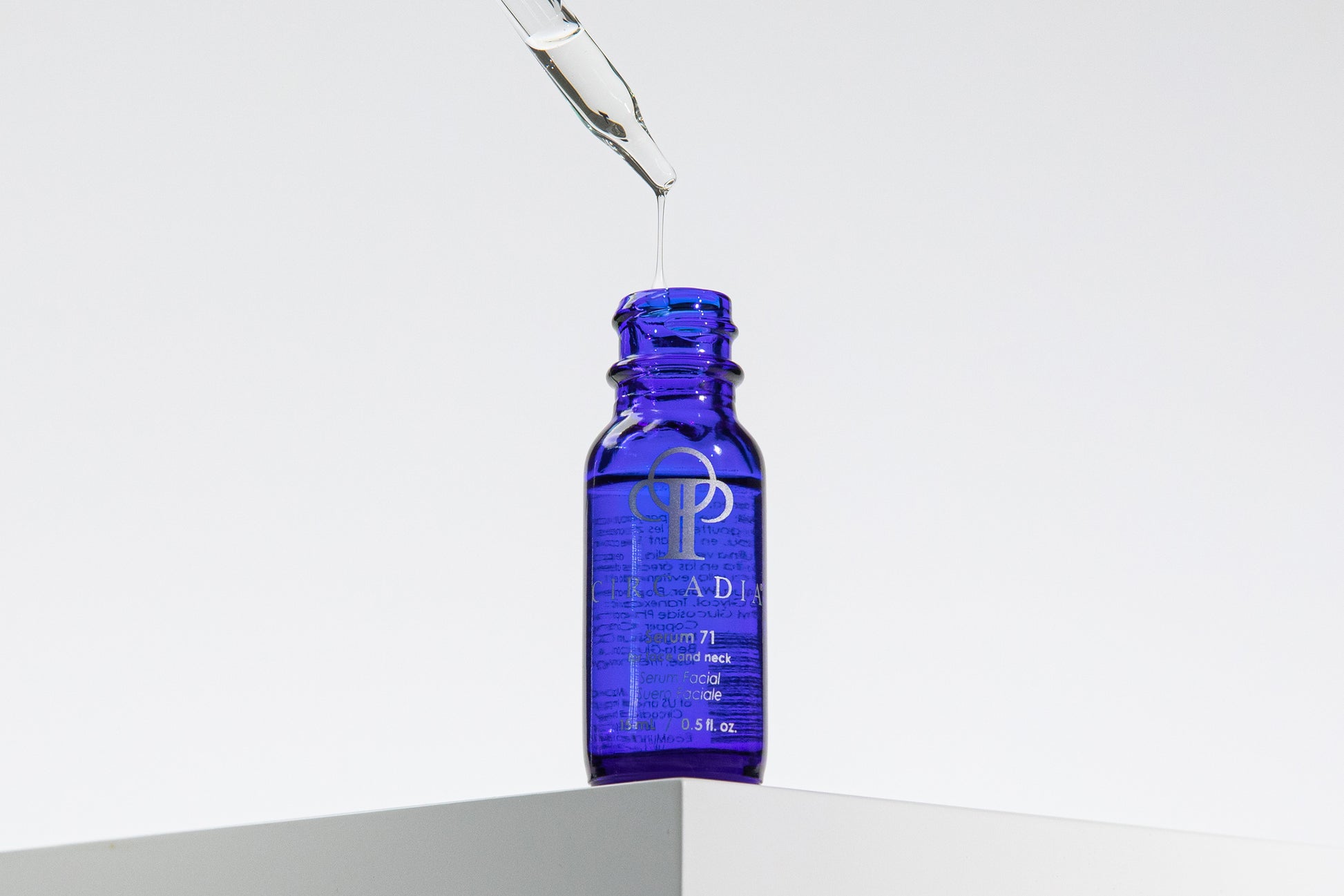 Blue Circaida serum 71 bottle with dropper on a white background