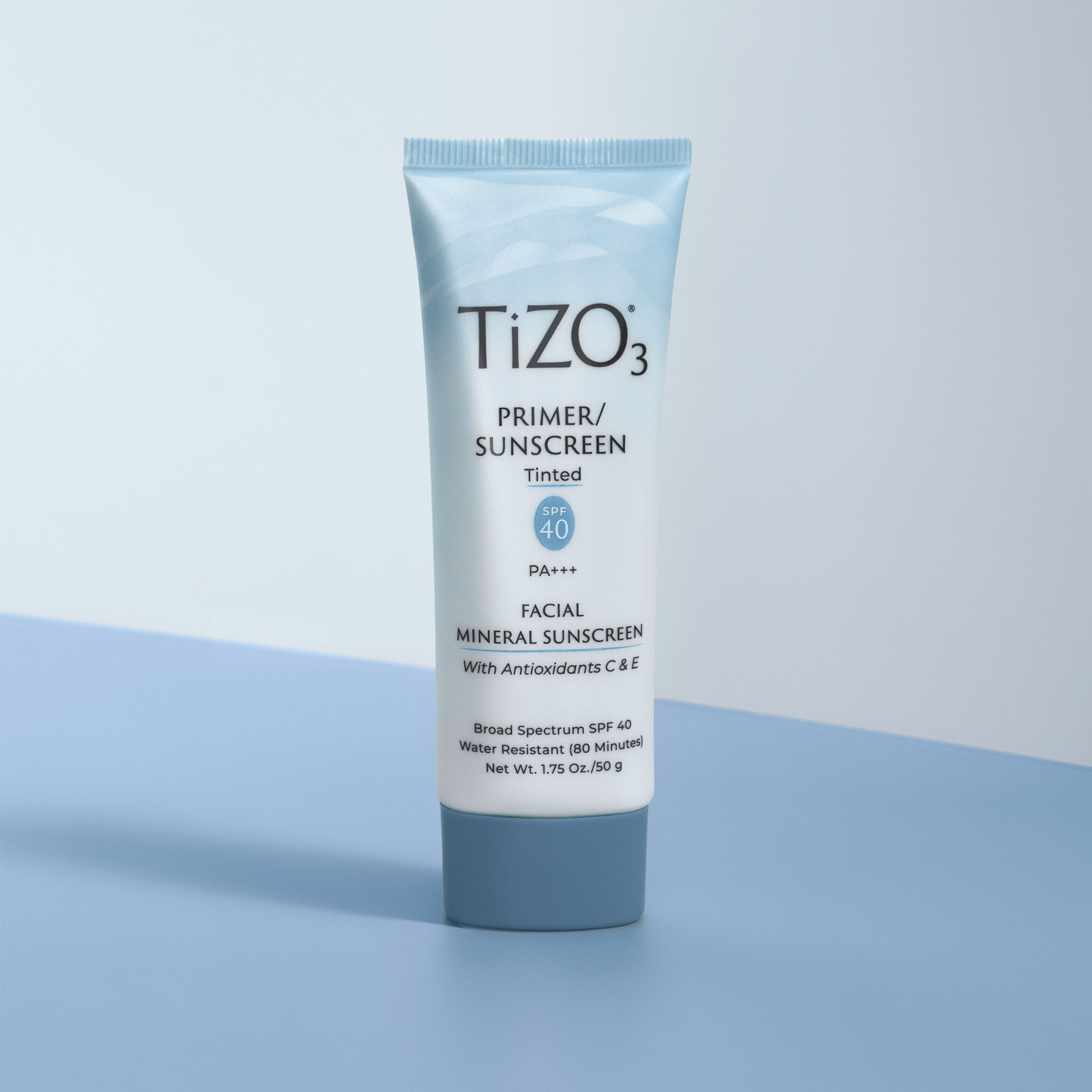TiZO Facial Primer - Tinted SPF 40 product tube against white and blue background