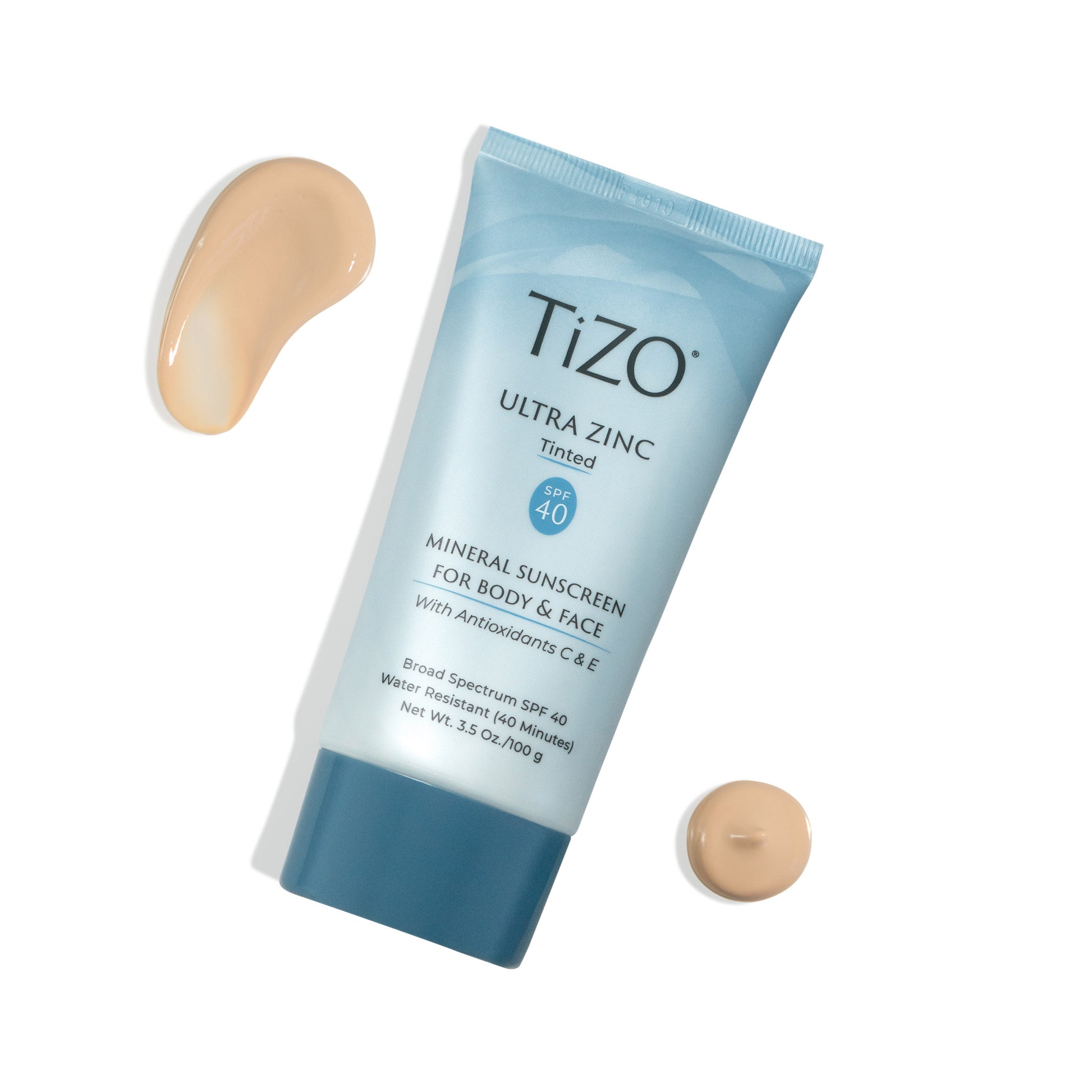 TiZO Ultra Zinc Body & Face - Tinted SPF 40 product tube with beige colored product swatches on a white background
