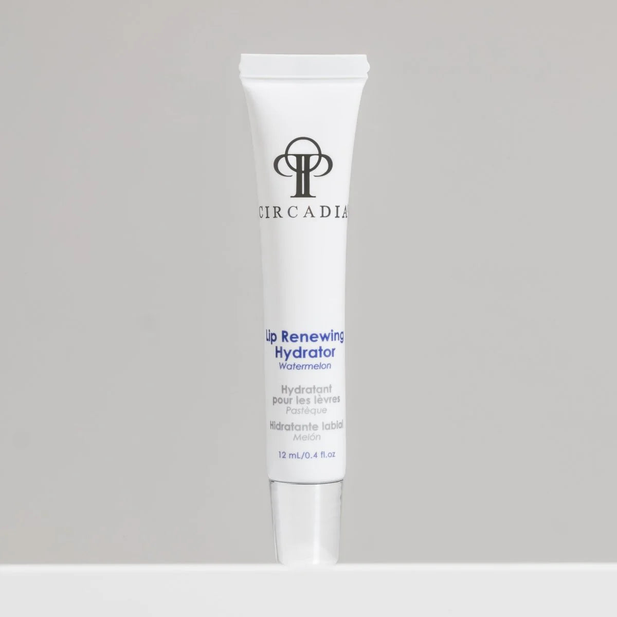 Circadia lip renewing hydrator tube on a gray background