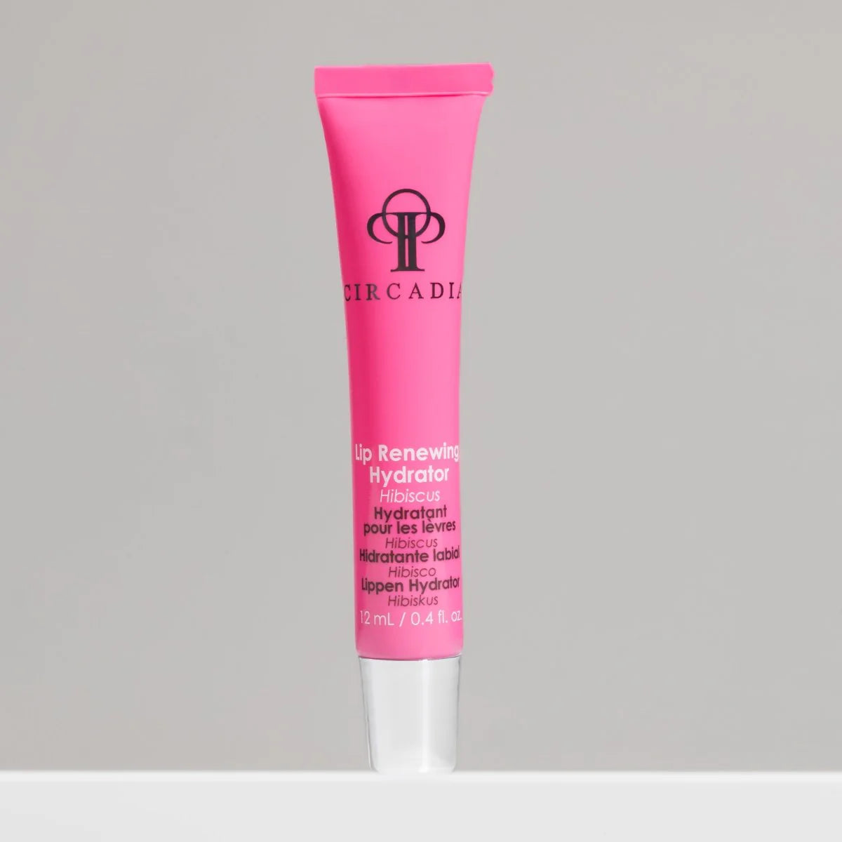 Pink tube of Circadia Lip Renewing Hydrator on a gray background
