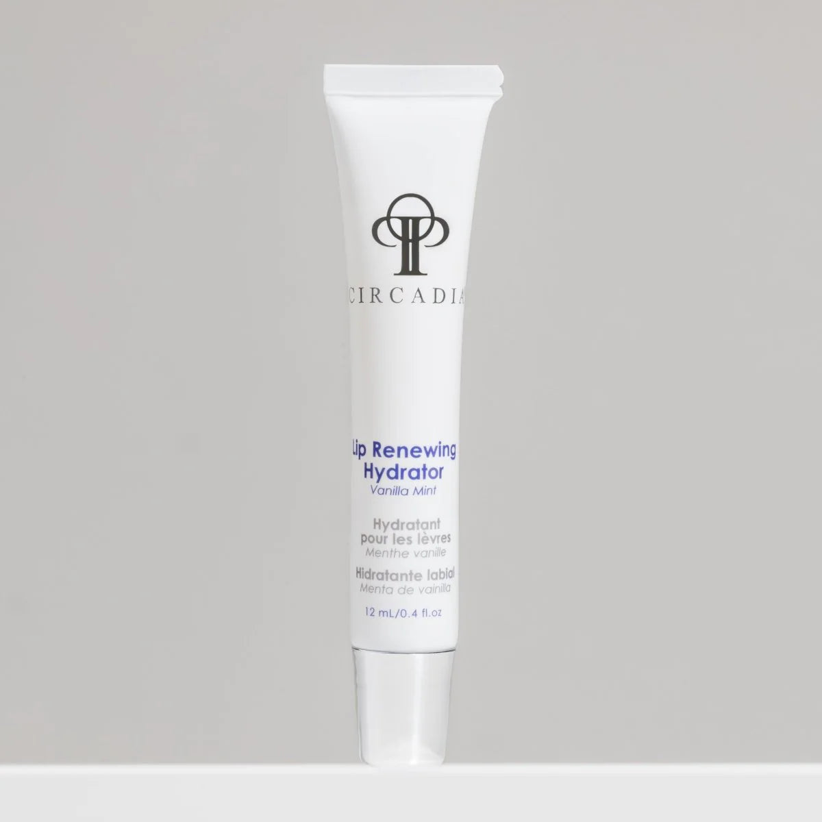 Circadia lip renewing hydrator tube on a gray background