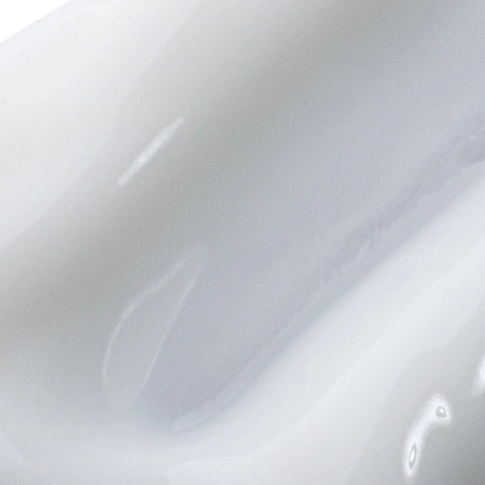 Close-up of a white cream with a glossy finish