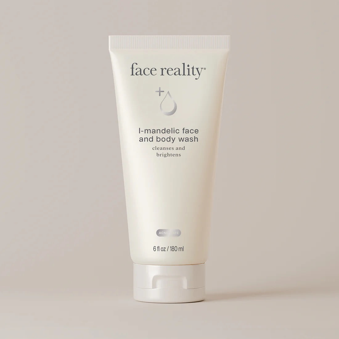 Face Reality's l-mandelic face and body wash in cream-colored tube against beige background