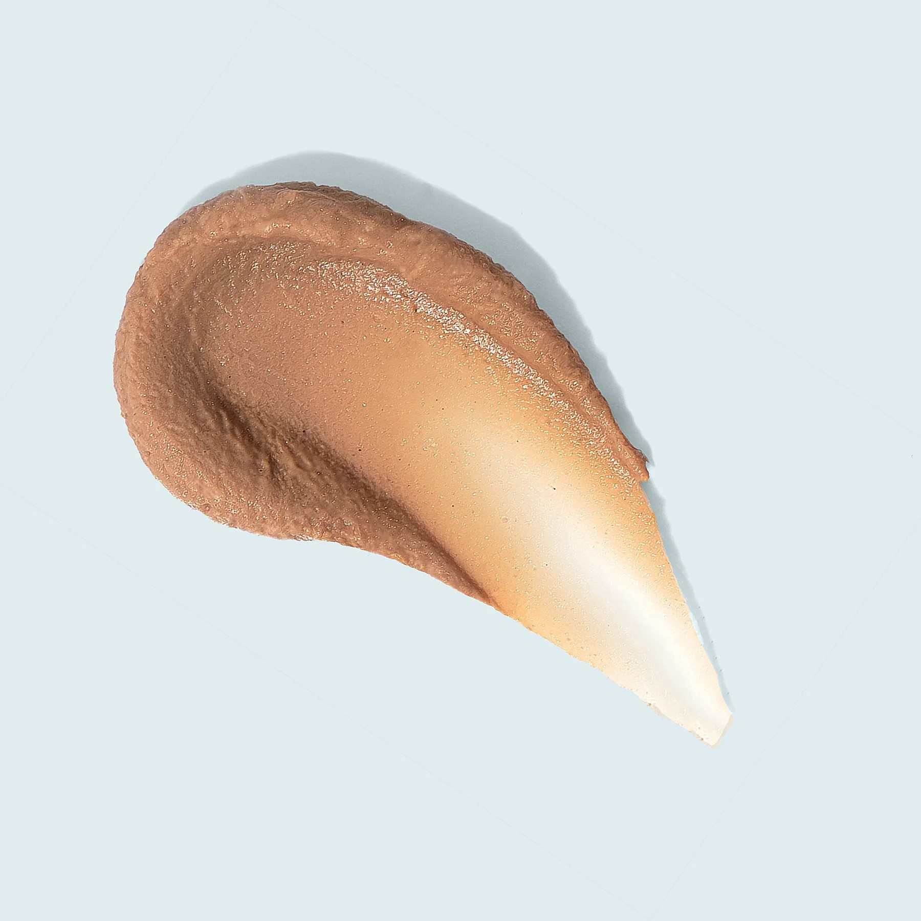 TiZO Facial Primer - Tinted SPF 40 tan colored product swatch against white background